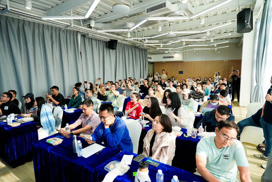 bright tabletop with assorted electronics, home goods, clothing, and accessories in soft natural light